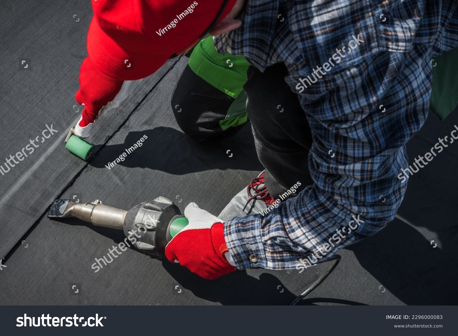 stock-photo-caucasian-roofing-worker-in-his-s-hot-air-blower-using-for-epdm-roof-membrane-rubber-installation-2296000083